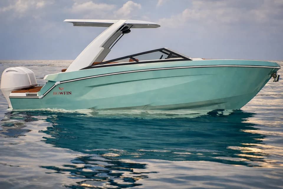 Bowfin boat in seafoam green on open water